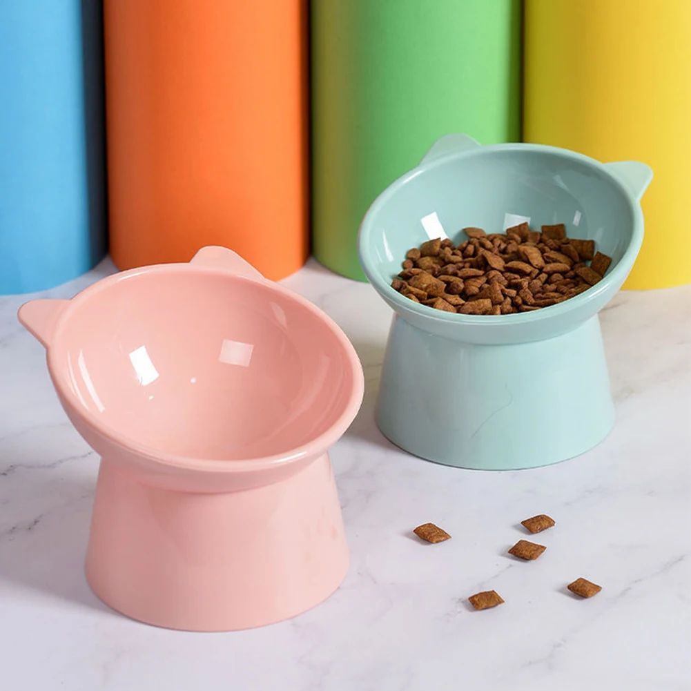 Tilted elevated cat food bowl with raised base, view 9